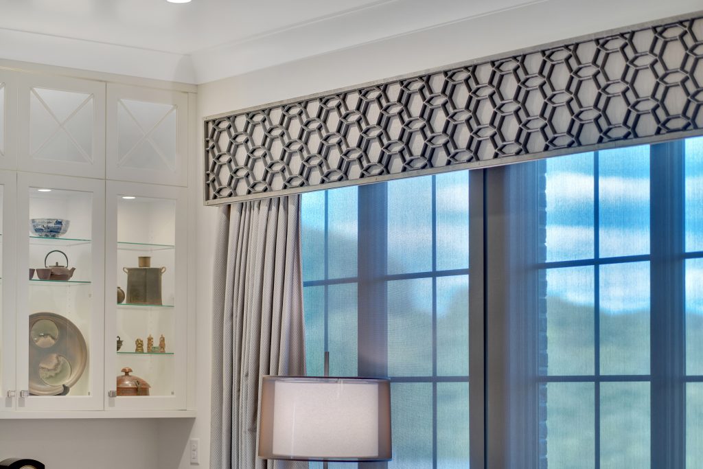 Elegant valences adorn doors with grace, adding to the living area's beauty and allure.