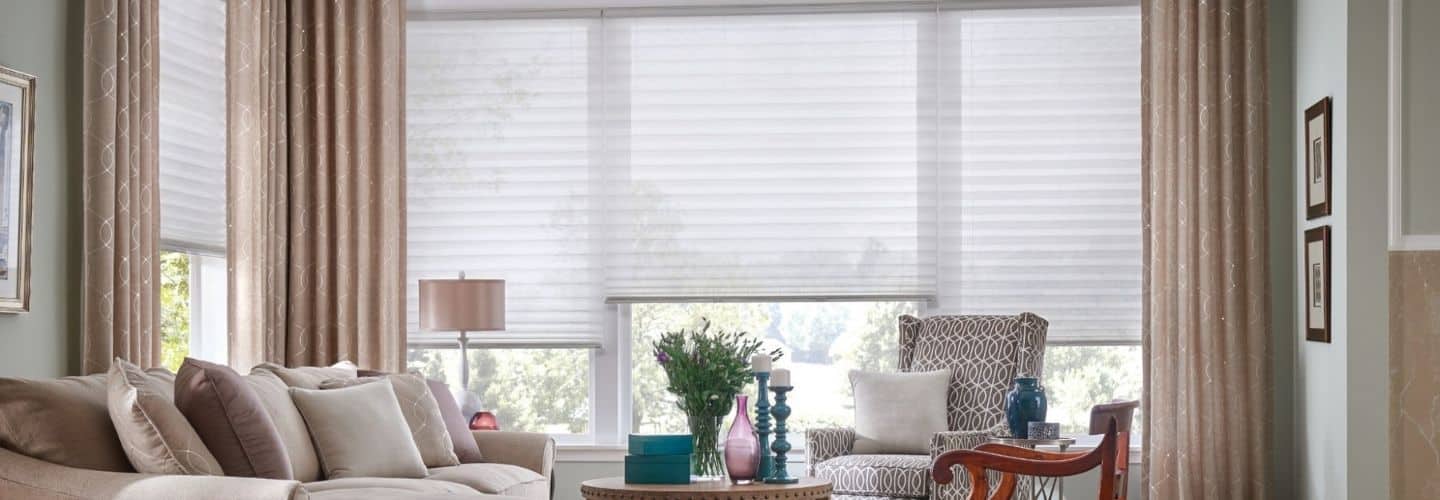 Over a window, elegant soft blinds create a comfortable atmosphere while letting in natural light.
