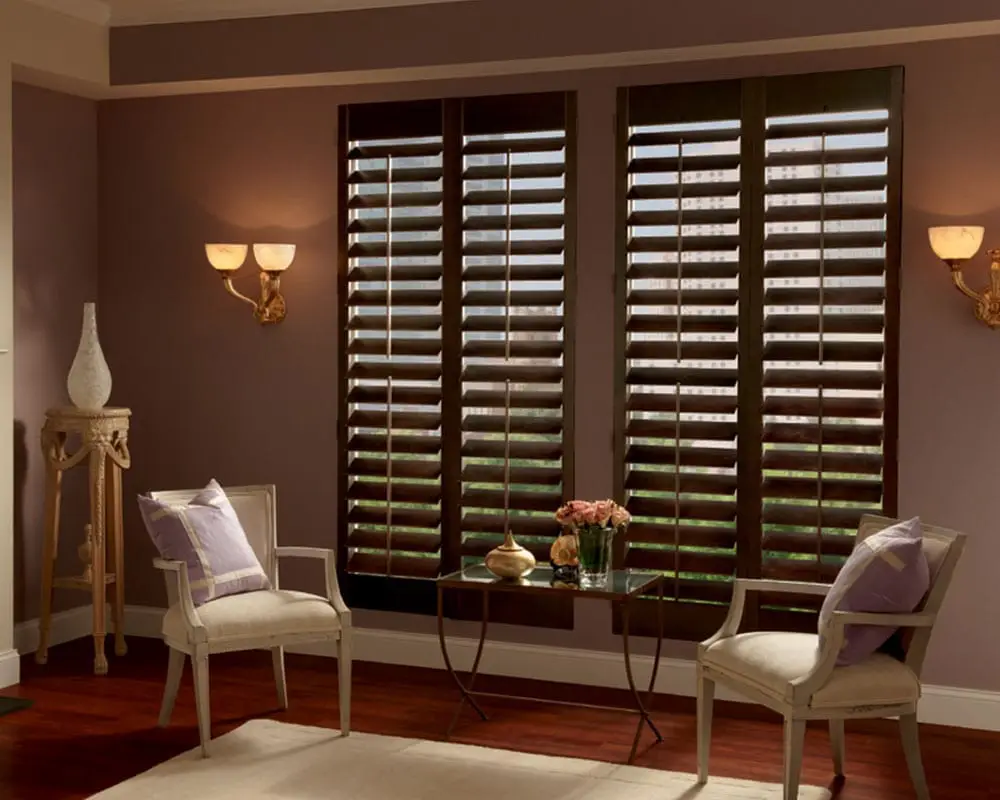 An indoor space with a brown shutter that adds to the warm colors and cozy ambiance.