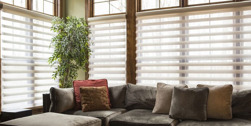 Elegant blinds that are partially drawn to let in natural light while also adding to the room's visual appeal.