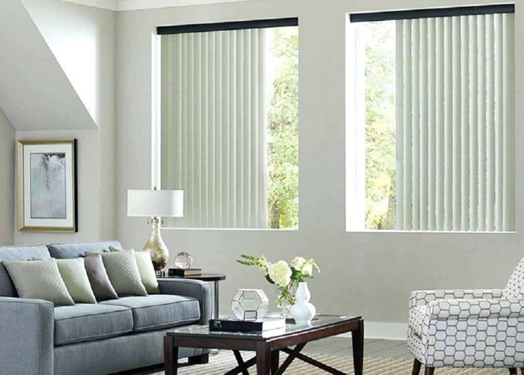 Soft blinds are tastefully suspended, offering seclusion in a modern space while letting in gentle light.