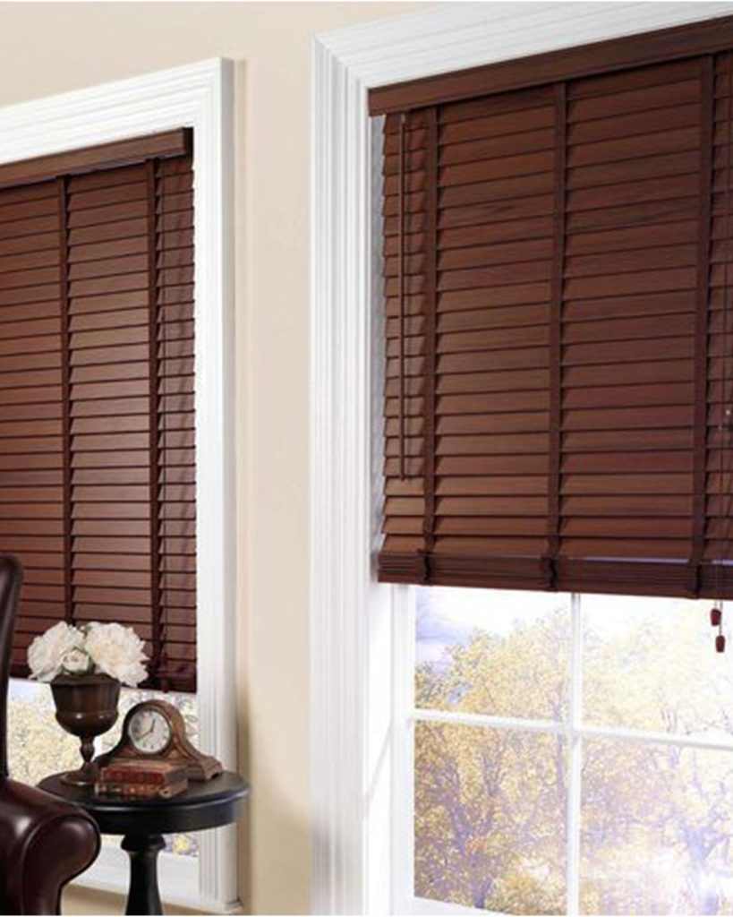 Elegant wood blinds with a refined appearance enhance the room's atmosphere while offering privacy and light control.