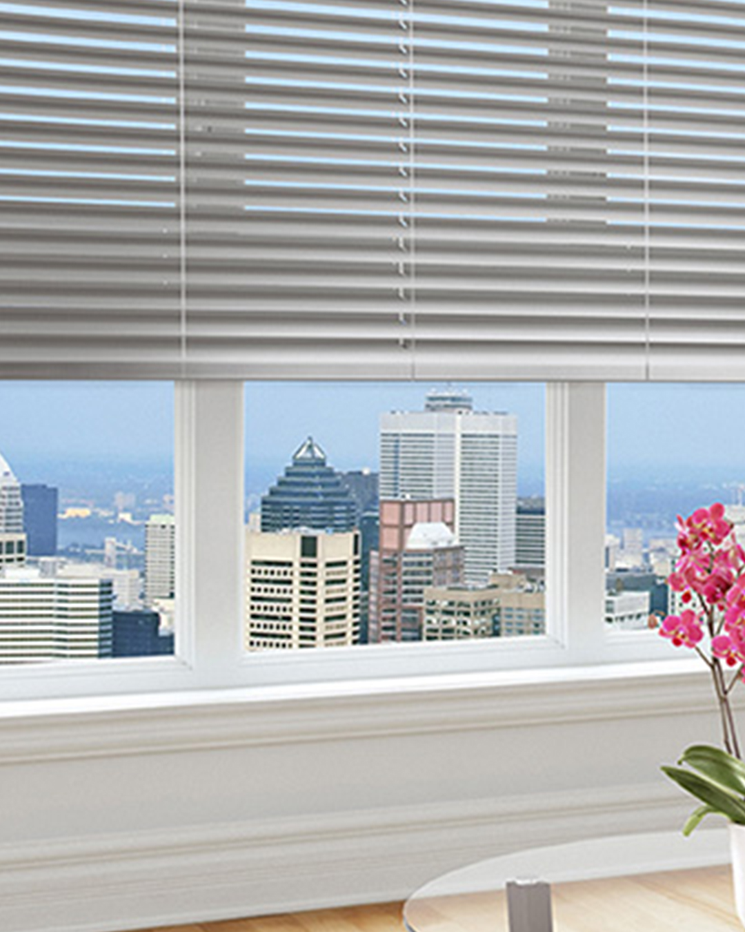 Aluminum blinds are tastefully placed in a window to improve privacy and light control while adding a modern appearance.