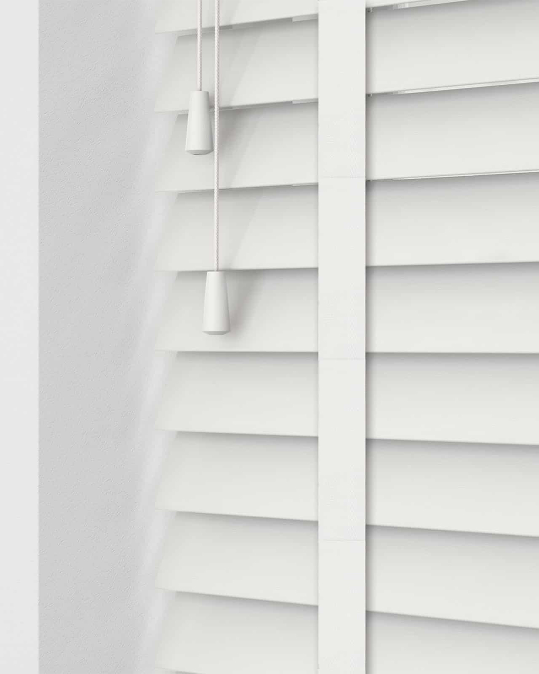 In a contemporary living room, faux wood blinds offer seclusion and style with a cozy, organic look.