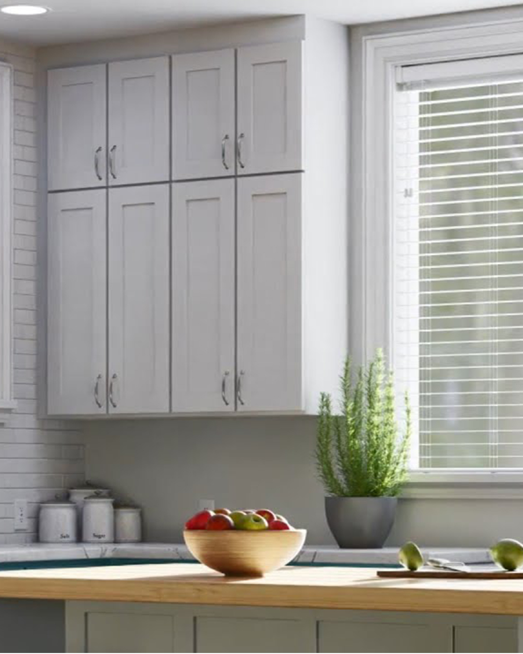 Contemporary composite blinds in a warm interior provide the ideal ratio of seclusion and light filtering for a relaxing ambiance.