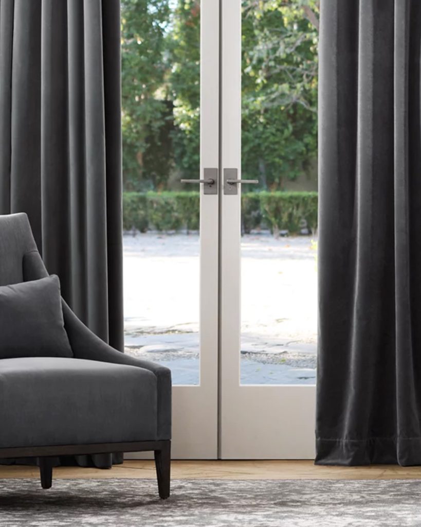 Exquisite, richly colored draperies that flow softly and add to the room's ambiance with their elegant design.