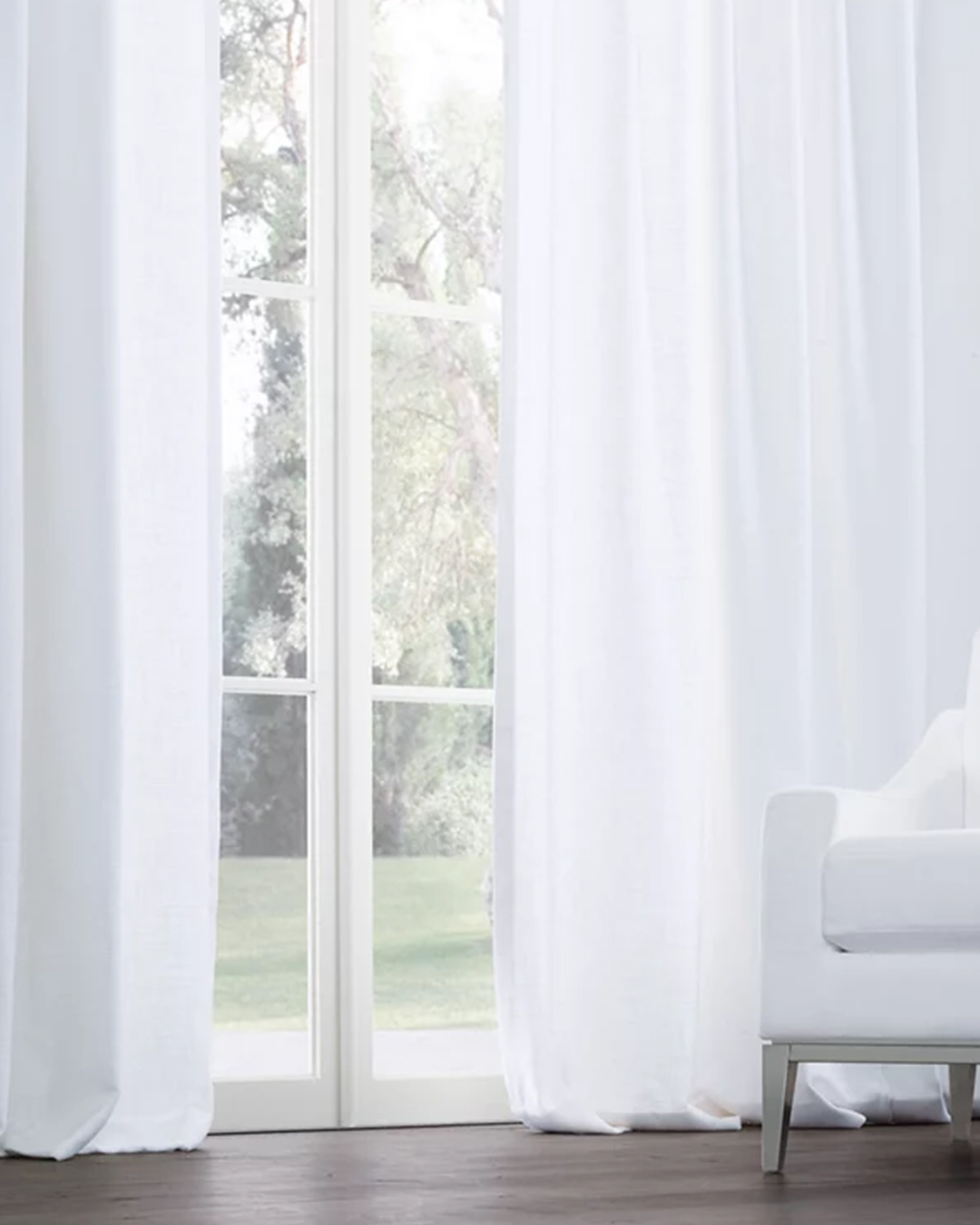 Richly colored, softly flowing, and elegantly designed, the drapery adds to the room's atmosphere.