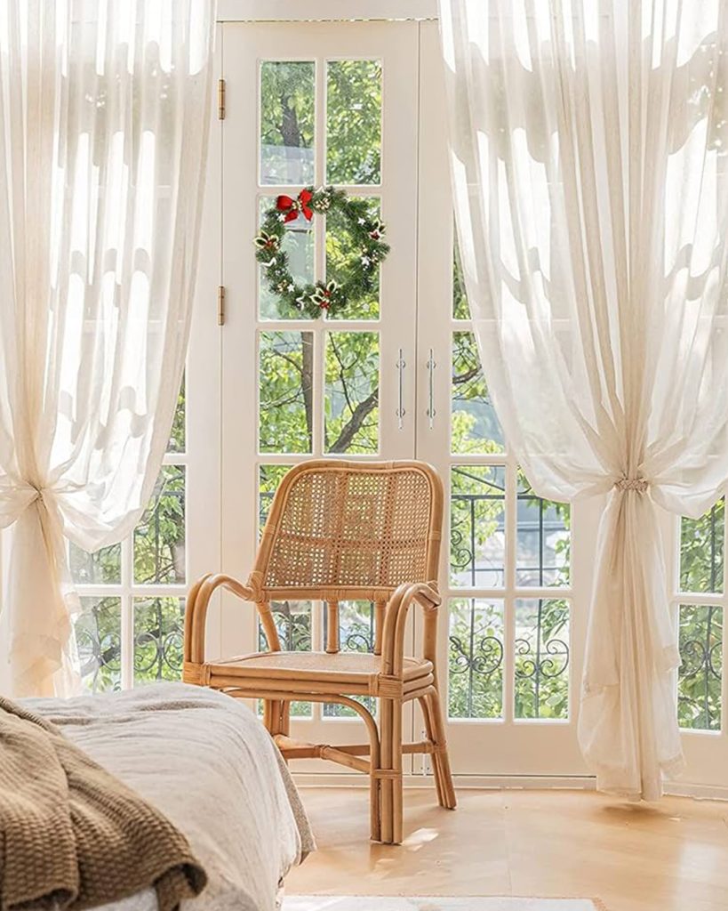Beautiful natural drapes delicately frame a window and add a touch of ambiance with their natural color and texture.