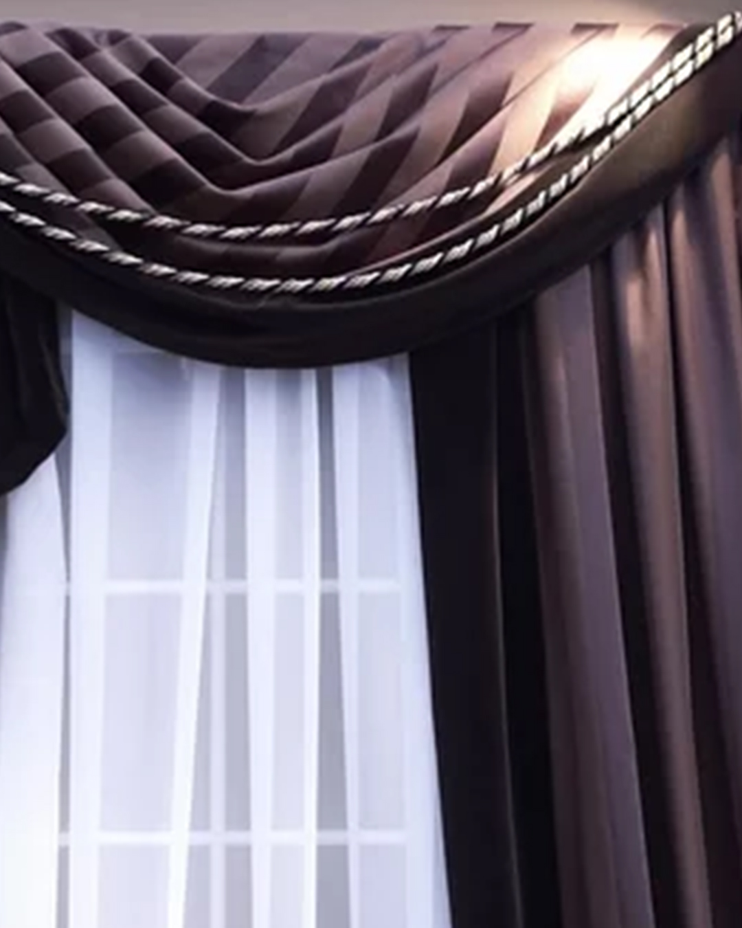 With fashionable fabric draping and ornamental trim, elegant cornices and valances accentuate window décor.