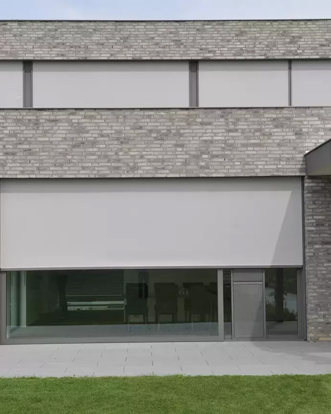 A residential window's zipper screen lets air and natural light in while keeping pests out.