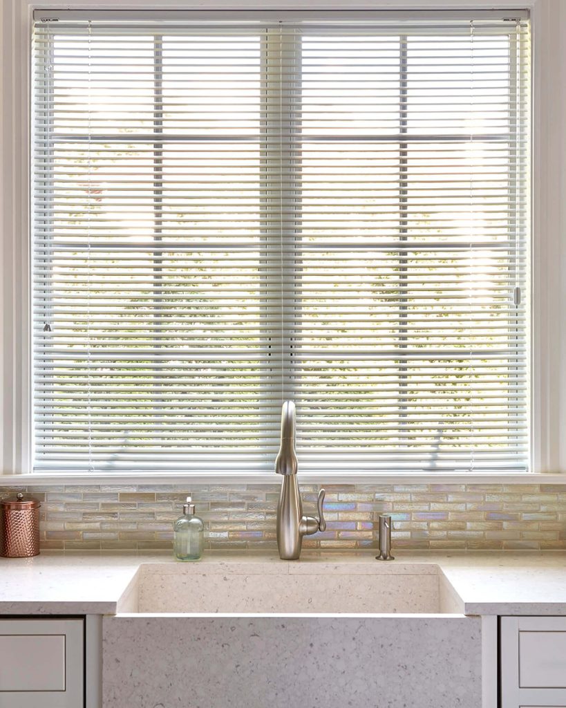 Modern aluminum blinds with a sleek appearance and light-control capabilities for added beauty and seclusion.